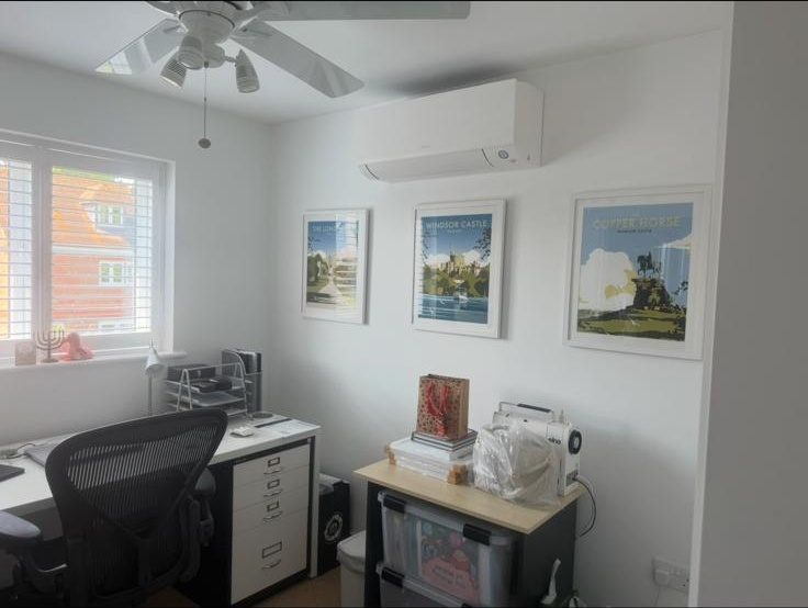 Wall-mounted AC unit installed in a home office