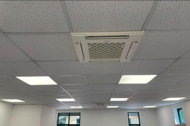 Ceiling cassette AC unit installed in an office